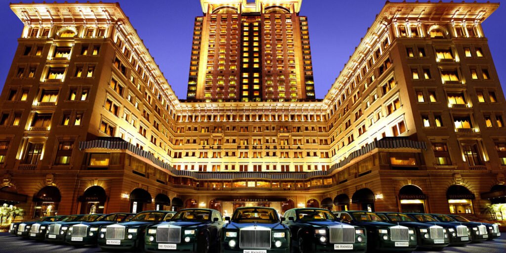 Iconic Rolls-Royce fleet outside Peninsula Hong Kong, a symbol of luxury at the best hotel in HK