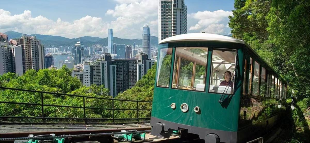 The Peak Tram climbing towards Sky Terrace with city views in the background